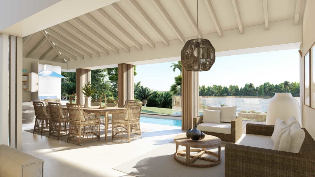 vue sur la terrasse et piscine privée coin confort avec table et fauteuils en osiers - martinique location villa – villa malawi